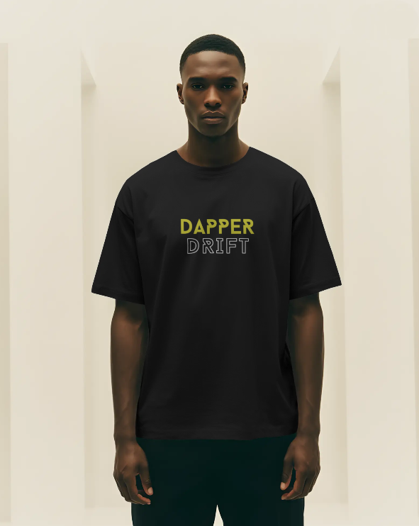 Man wearing a black t-shirt with 'Dapper Drift' text on a plain background